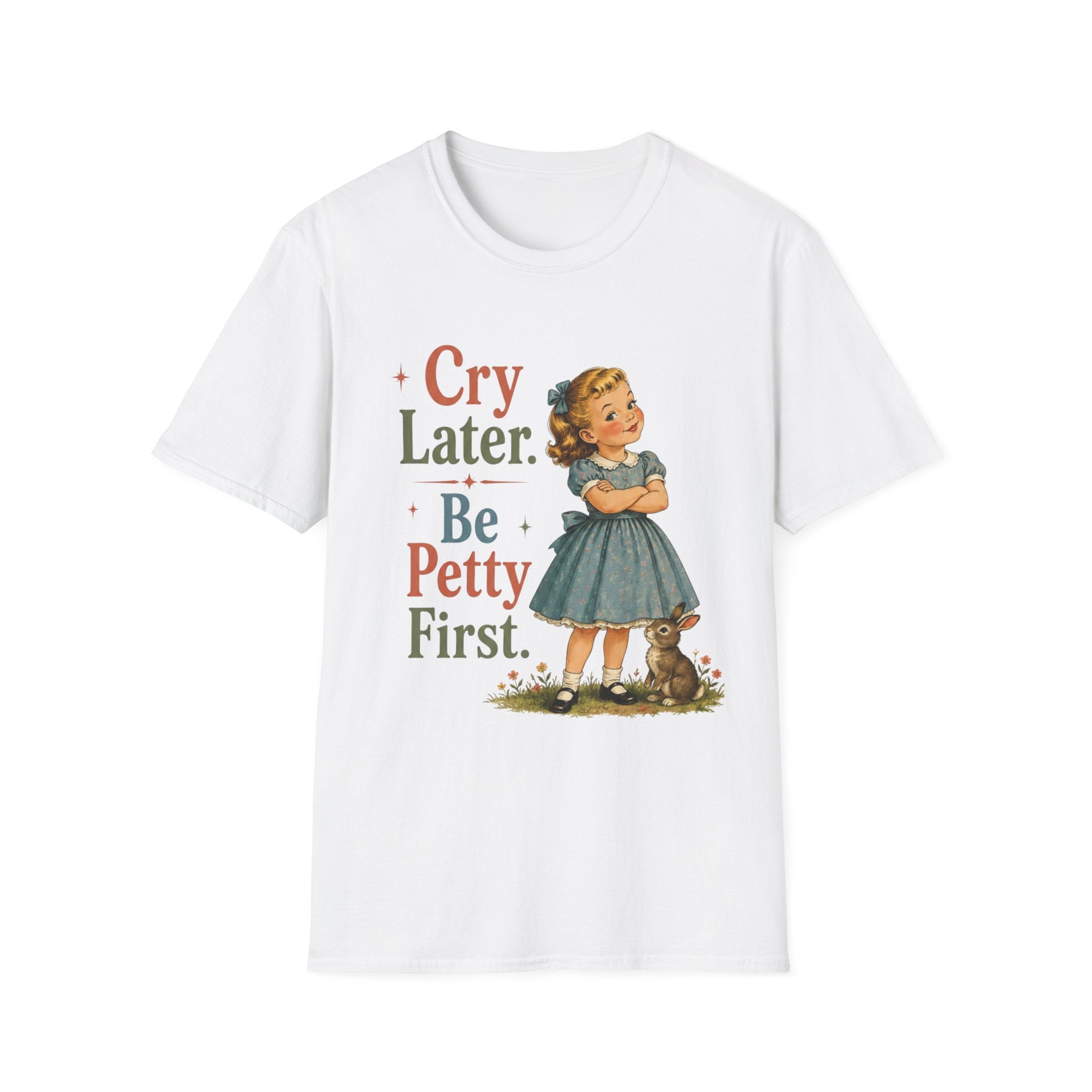 A white short-sleeve crewneck t-shirt featuring a vintage-style graphic of a young girl in a blue dress standing next to a small rabbit, with the text 'Cry Later. Be Petty First.