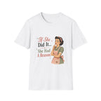 A white short-sleeve crewneck t-shirt featuring a retro-style graphic print of a woman in a pink apron next to the text 'If She Did It.
