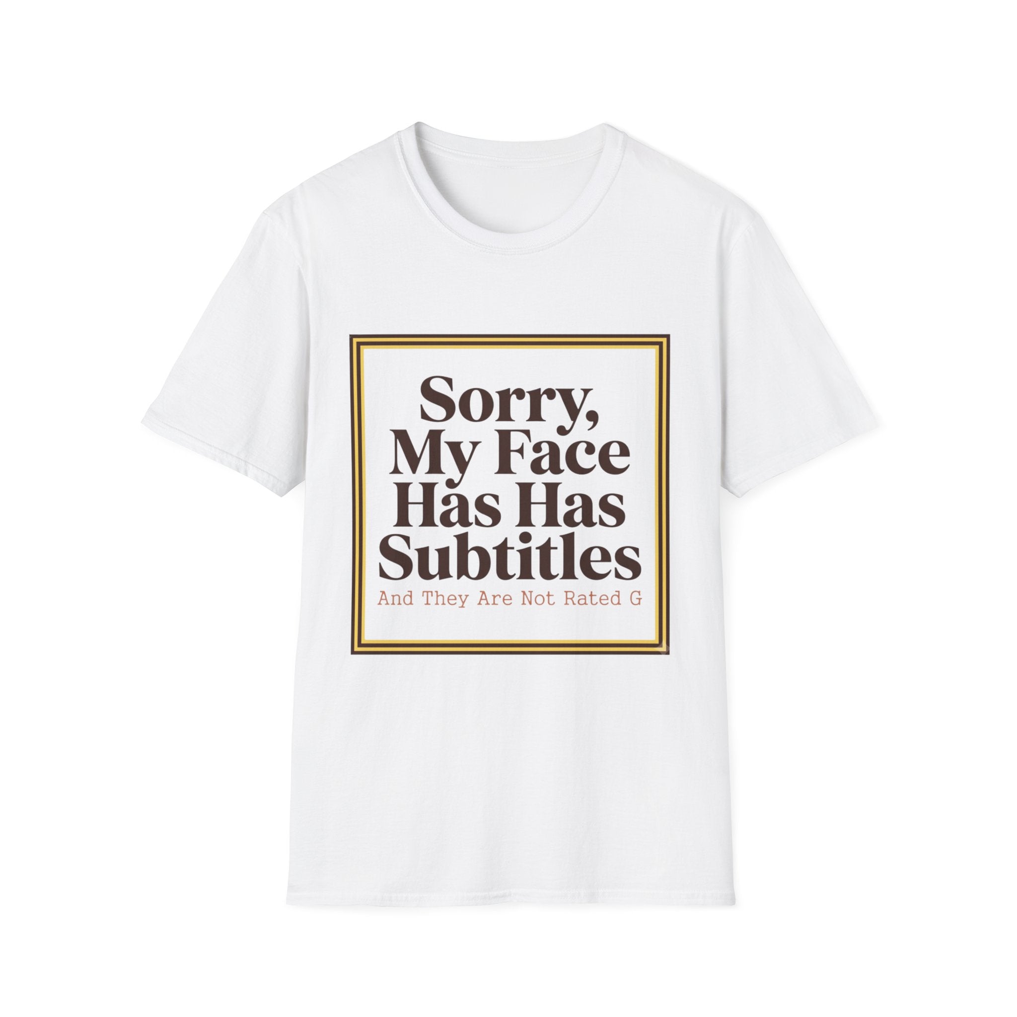 A white short-sleeve crewneck t-shirt with a graphic print on the front. The print features a gold-bordered square containing the text 'Sorry, My Face Has Has Subtitles And They Are Not Rated G' in dark brown lettering.