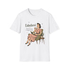 A white short-sleeve crewneck t-shirt featuring a retro-style graphic of a woman in a pink dress sitting in an armchair, with the text 'Unbothered. Mostly because I stopped caring.