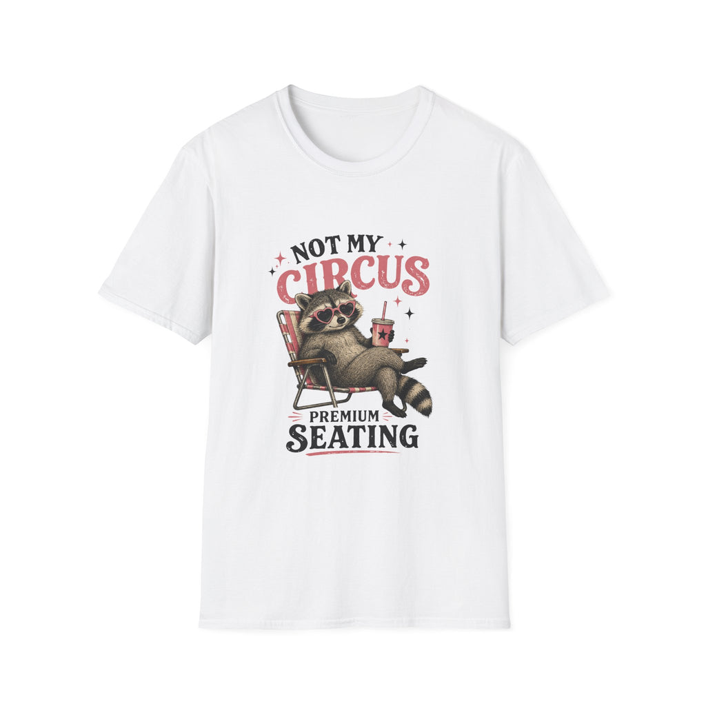 A white short-sleeve crewneck t-shirt featuring a graphic print of a raccoon sitting in a red chair with the text 'NOT MY CIRCUS PREMIUM SEATING'.