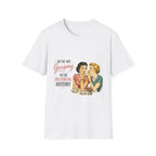 A white short-sleeve crewneck t-shirt featuring a vintage-style graphic print of two women at a table with the text 'WE'RE NOT Gossiping WE'RE PRESERVING HISTORY'.