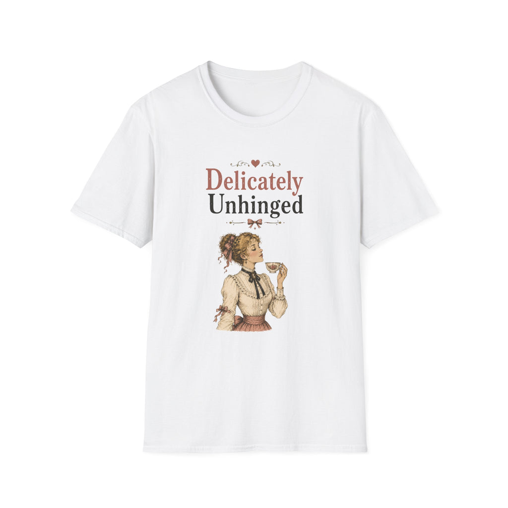 A white short-sleeve crewneck t-shirt featuring a vintage-style graphic print on the front. The graphic displays the text 'Delicately Unhinged' in a dusty rose and black font, above an illustration of a woman in a 1920s flapper outfit.