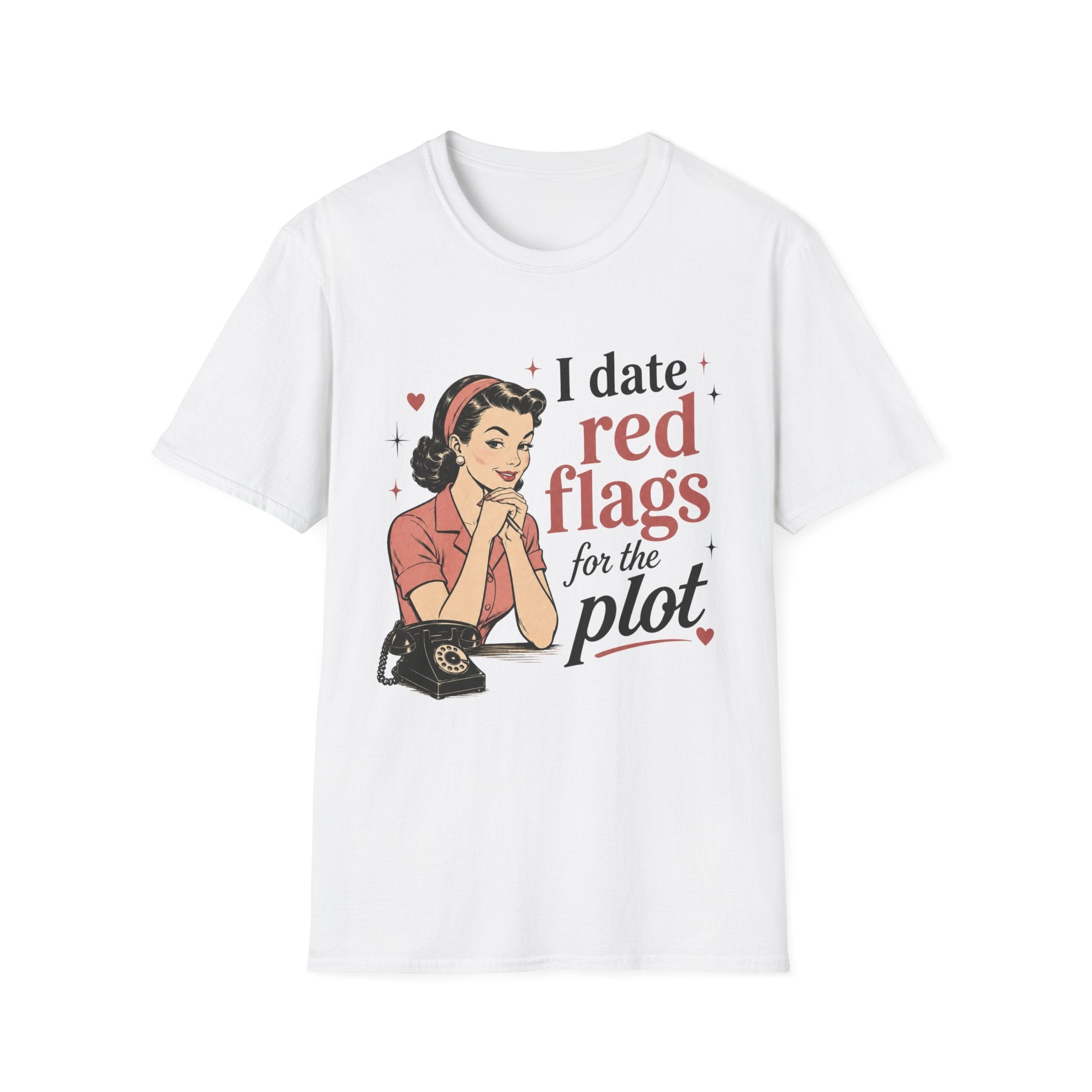 A white short-sleeve crewneck t-shirt featuring a retro-style graphic of a woman in a pink top and red headband sitting at a desk with a rotary phone, next to the text 'I date red flags for the plot'.