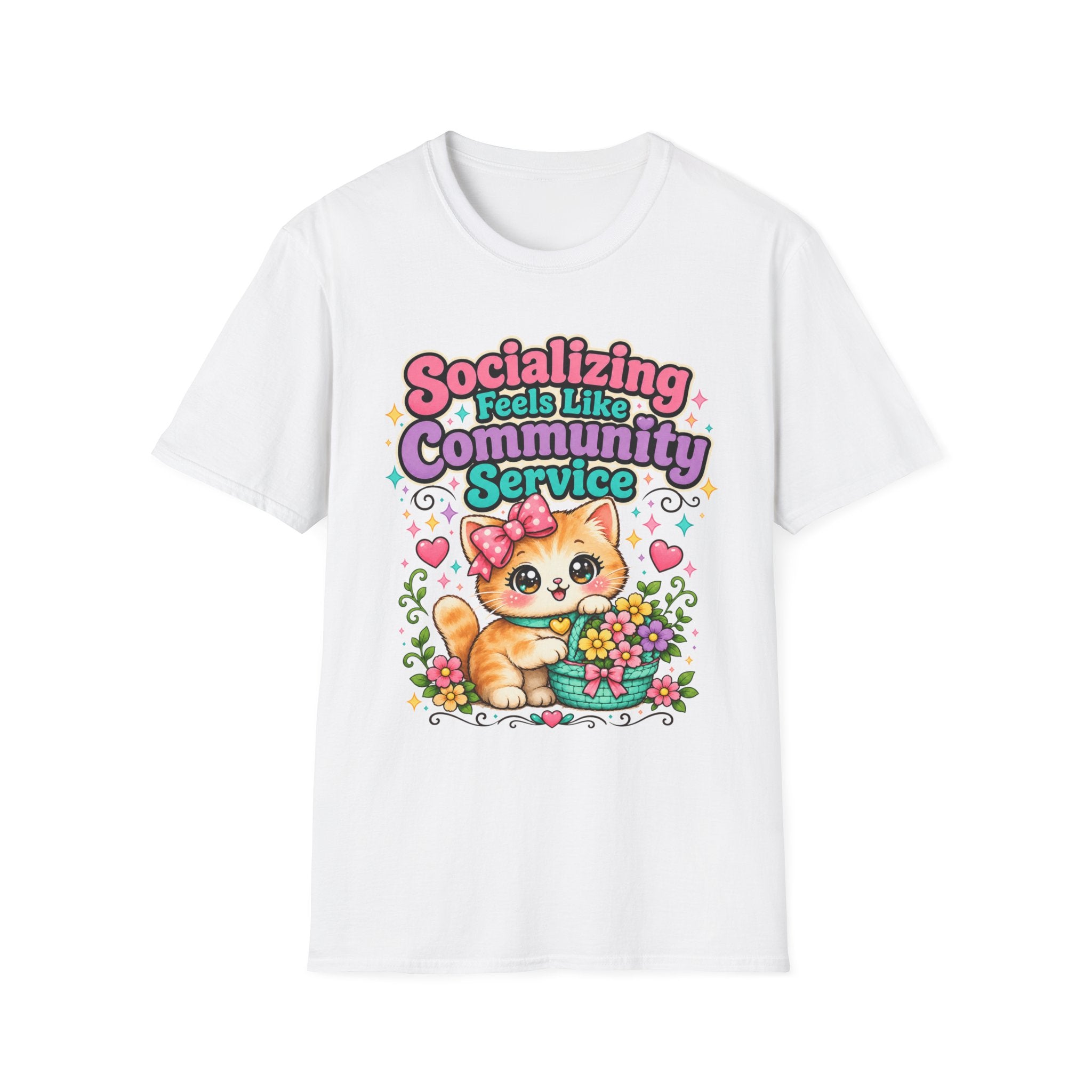 A white short-sleeve crewneck t-shirt featuring a colorful graphic print of a cute orange tabby kitten holding a basket of flowers, surrounded by the text 'Socializing Feels Like Community Service' in pink, purple, and blue lettering.