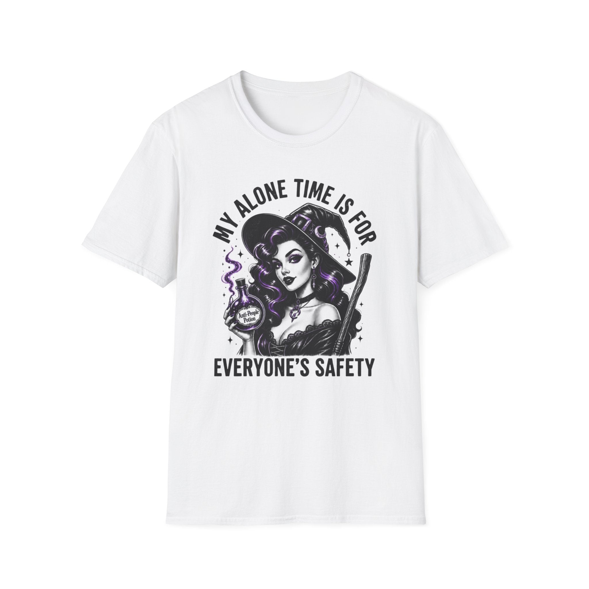 A white short-sleeve crewneck t-shirt featuring a graphic print of a witch with a broom and a potion cup, accompanied by the text 'MY ALONE TIME IS FOR EVERYONE'S SAFETY' in black and purple.